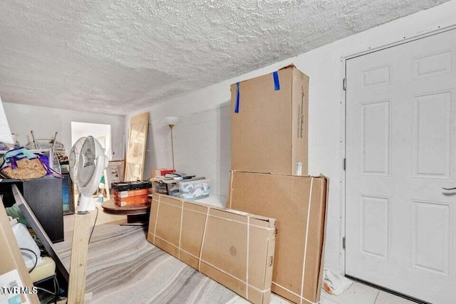 interior space with a textured ceiling