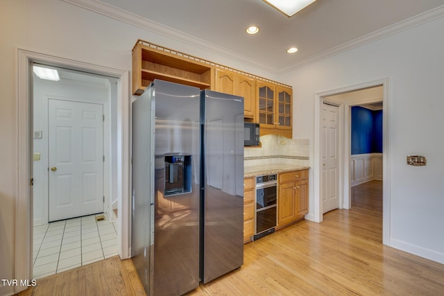 kitchen with tasteful backsplash, stainless steel fridge, light hardwood / wood-style flooring, and crown molding