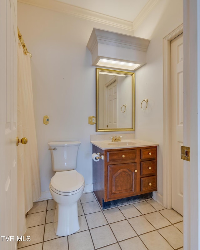 bathroom with toilet, tile patterned flooring, vanity, and ornamental molding