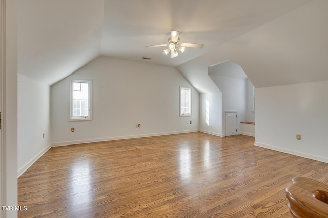 bonus room featuring ceiling fan, light hardwood / wood-style flooring, and vaulted ceiling