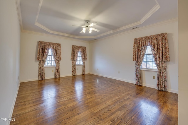 spare room with dark hardwood / wood-style flooring, a wealth of natural light, and ceiling fan