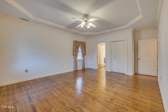 unfurnished room featuring hardwood / wood-style flooring, ceiling fan, and ornamental molding