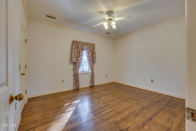 empty room featuring wood-type flooring, ceiling fan, and crown molding