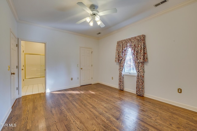 unfurnished room with ceiling fan, hardwood / wood-style floors, and ornamental molding