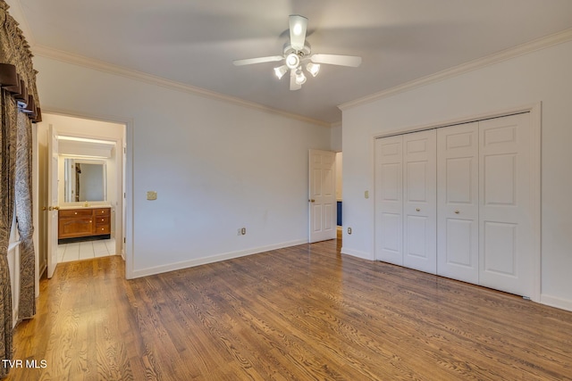 unfurnished bedroom with hardwood / wood-style floors, ceiling fan, and ornamental molding