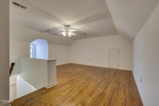 additional living space featuring hardwood / wood-style floors, ceiling fan, and vaulted ceiling