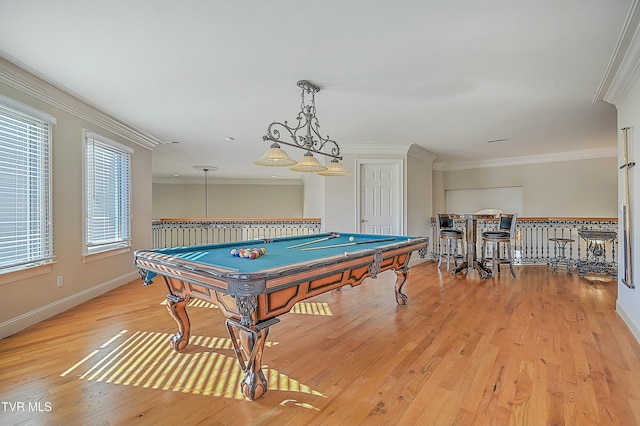 recreation room featuring ornamental molding, light wood-type flooring, and pool table