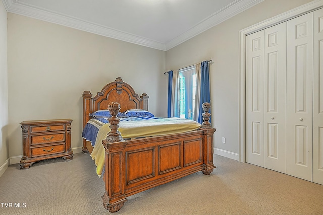 carpeted bedroom featuring a closet and ornamental molding