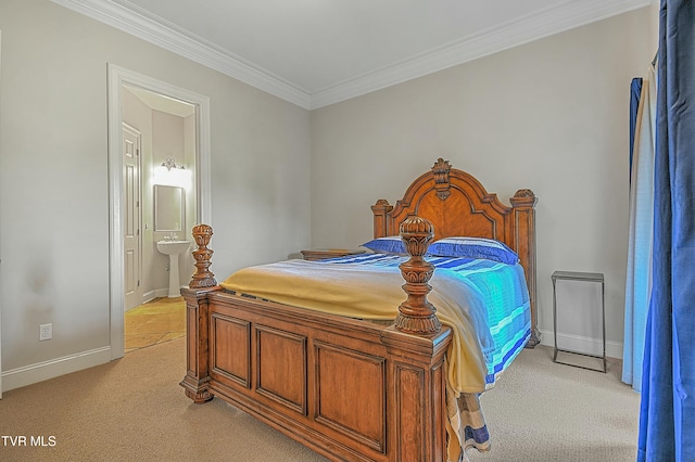 carpeted bedroom featuring connected bathroom and ornamental molding