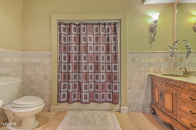 full bathroom with vanity, shower / bath combo, tile walls, and toilet