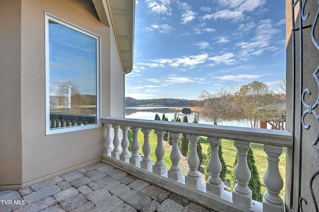 balcony featuring a water view