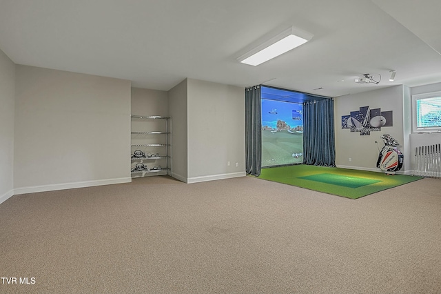 playroom with radiator, carpet, and golf simulator