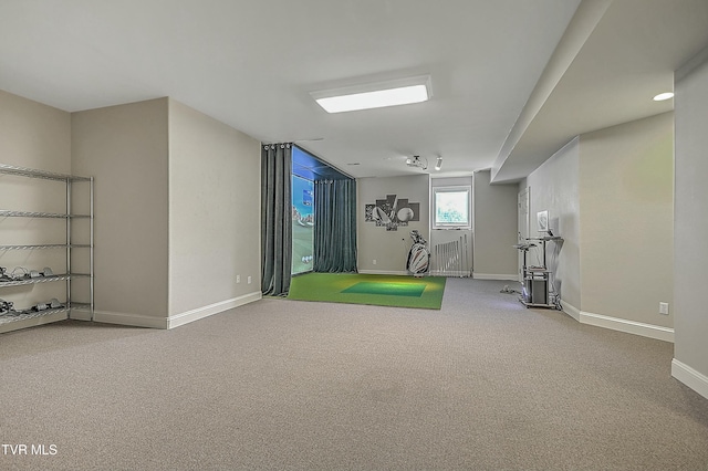 workout room with carpet and golf simulator