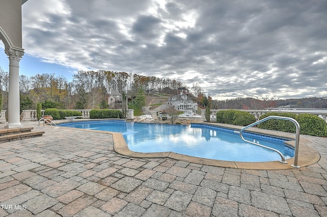 view of swimming pool featuring a patio