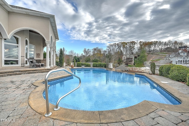 view of swimming pool featuring a patio