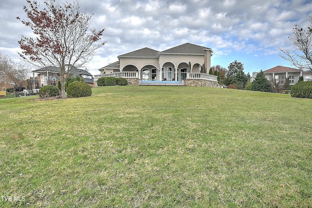 view of front of home with a front lawn