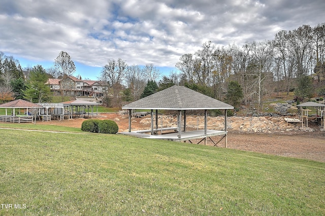 view of home's community with a gazebo and a yard