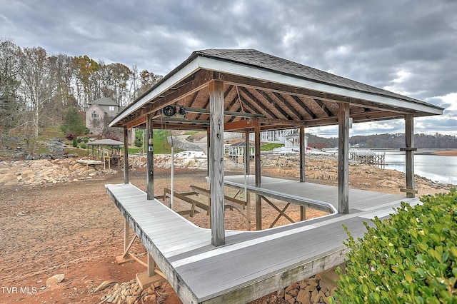 wooden deck featuring a water view