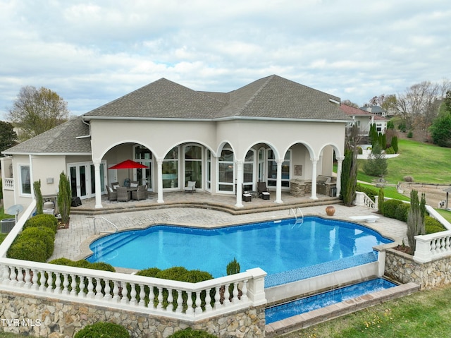 rear view of house with an outdoor living space and a patio