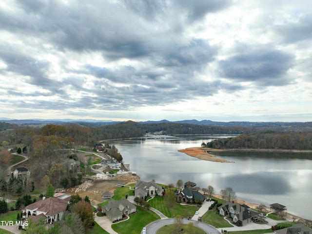 birds eye view of property featuring a water and mountain view