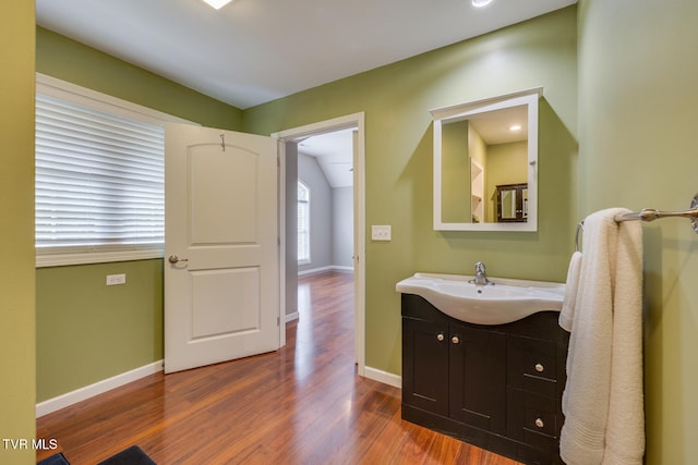 bathroom featuring vanity and hardwood / wood-style flooring