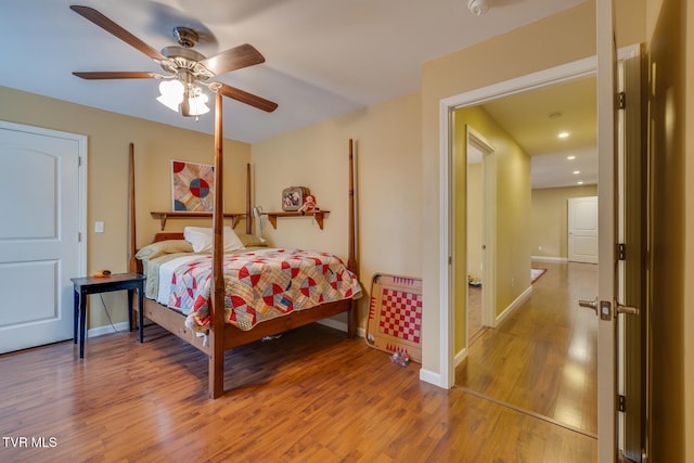 bedroom featuring wood-type flooring and ceiling fan