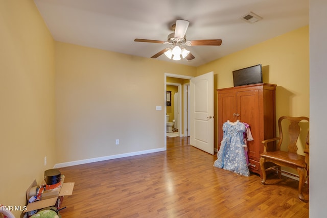 interior space with hardwood / wood-style flooring and ceiling fan