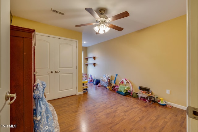 recreation room featuring wood-type flooring and ceiling fan