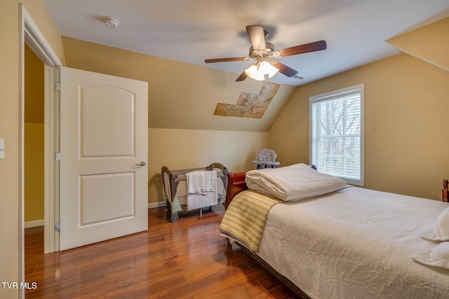 bedroom with lofted ceiling, dark wood-type flooring, and ceiling fan