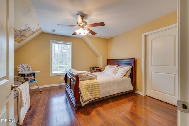 bedroom featuring lofted ceiling, dark wood-type flooring, and ceiling fan