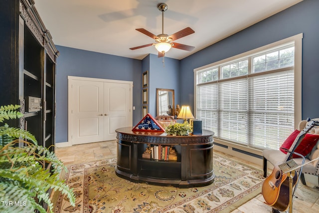 living area featuring ceiling fan