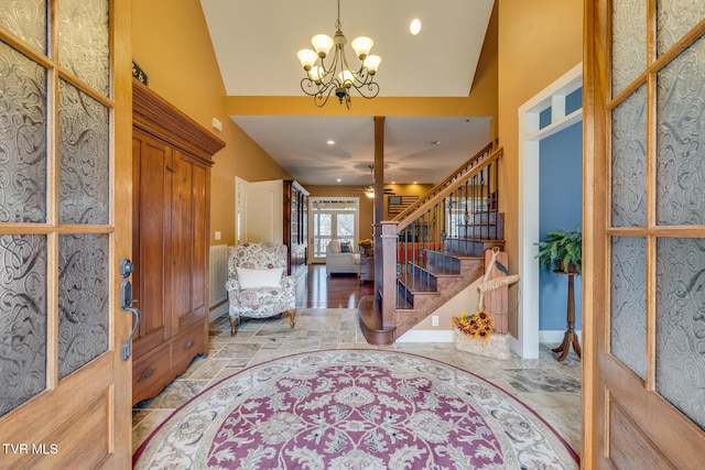 foyer with vaulted ceiling and a chandelier