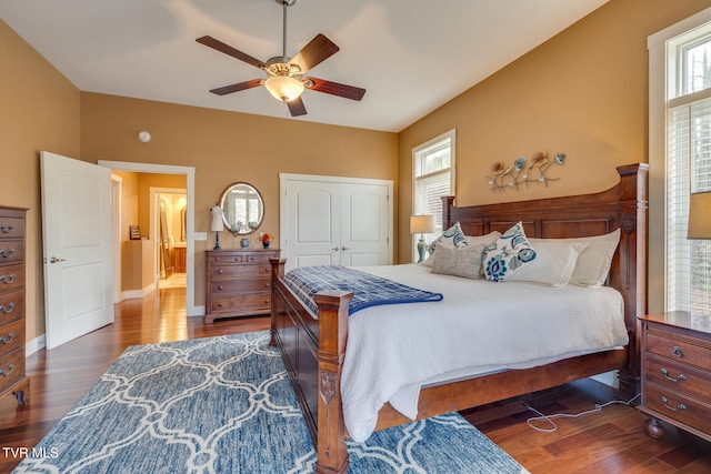 bedroom featuring dark hardwood / wood-style flooring, a closet, and ceiling fan