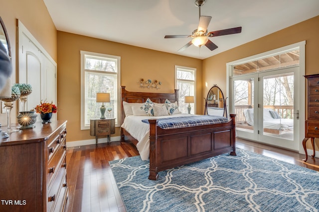 bedroom featuring dark hardwood / wood-style flooring, access to exterior, and ceiling fan