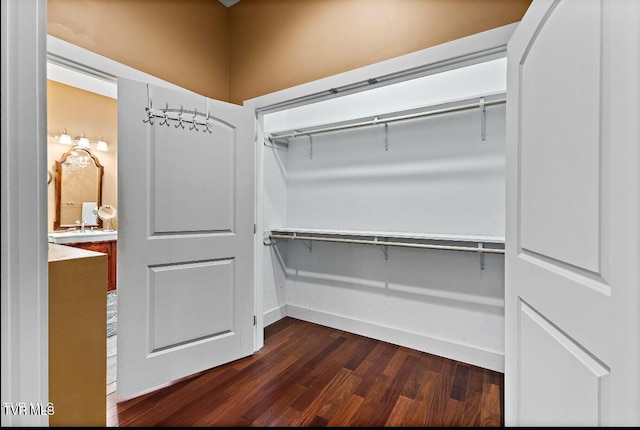 walk in closet featuring dark hardwood / wood-style flooring