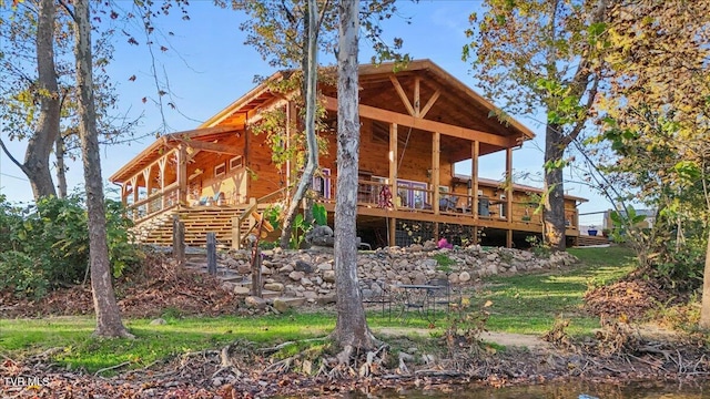 back of property with a wooden deck