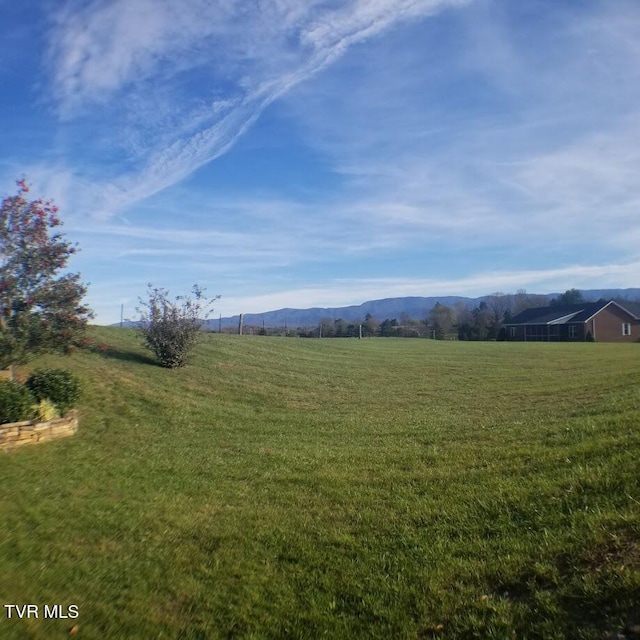 property view of mountains featuring a rural view