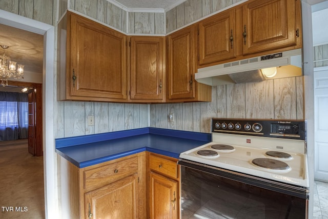 kitchen with white electric range oven and a notable chandelier