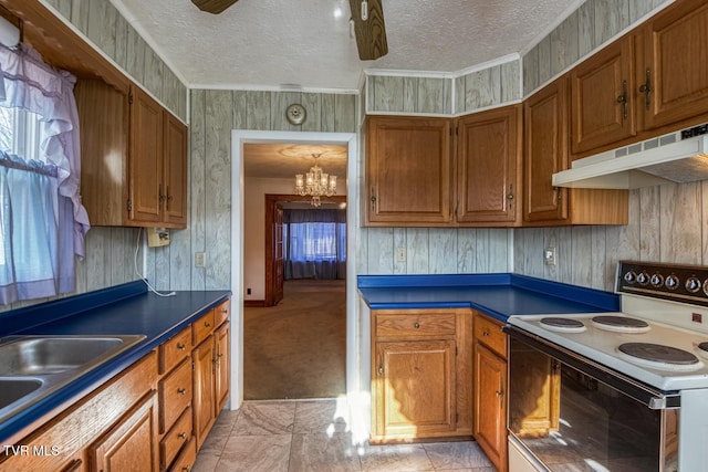 kitchen with white electric range oven, wood walls, light colored carpet, a textured ceiling, and ceiling fan with notable chandelier