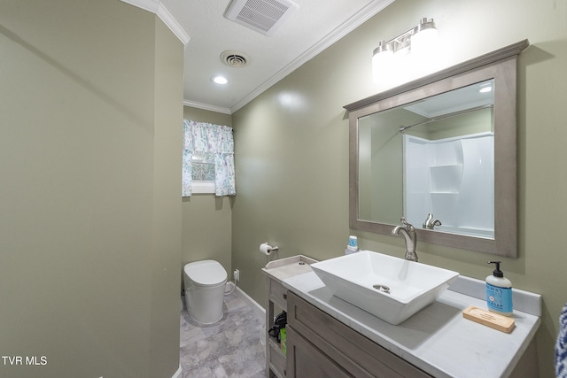 bathroom featuring vanity, toilet, and crown molding