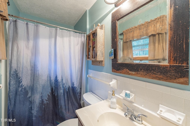 bathroom with a shower with shower curtain, backsplash, vanity, a textured ceiling, and toilet