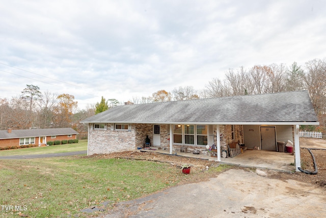 ranch-style home with a front lawn and a carport