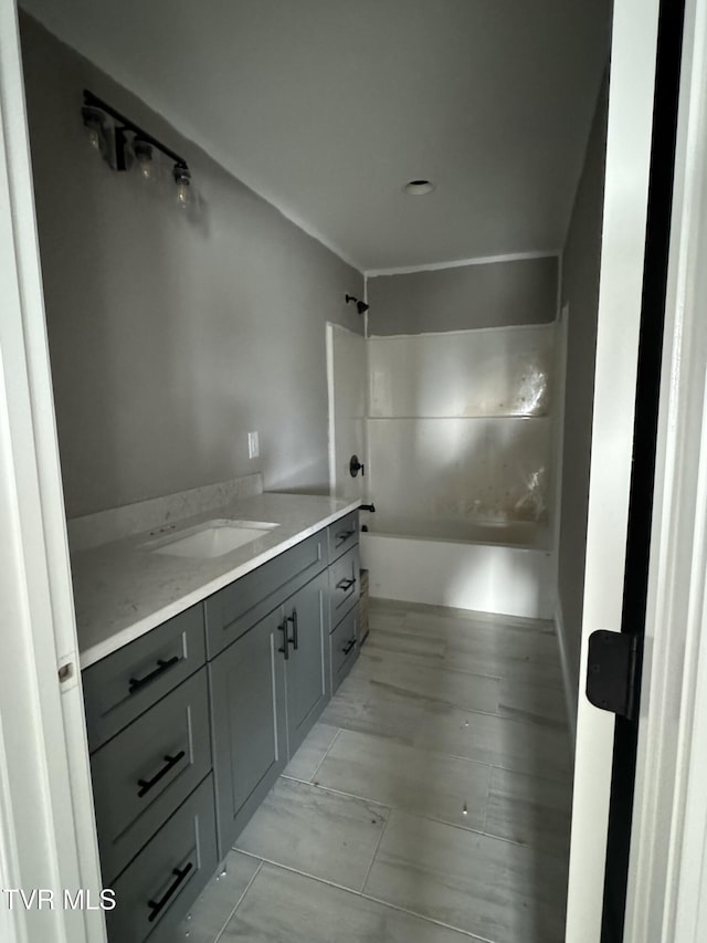 bathroom with vanity and shower / bathing tub combination