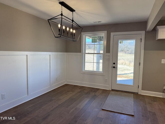 entryway with dark hardwood / wood-style flooring