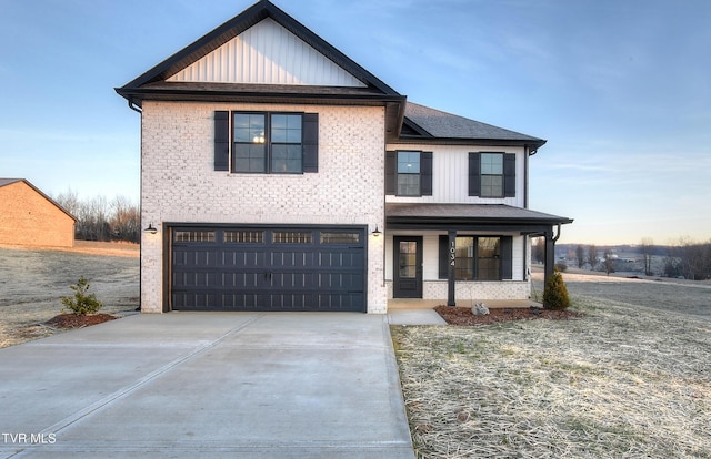 view of front facade with a garage and covered porch