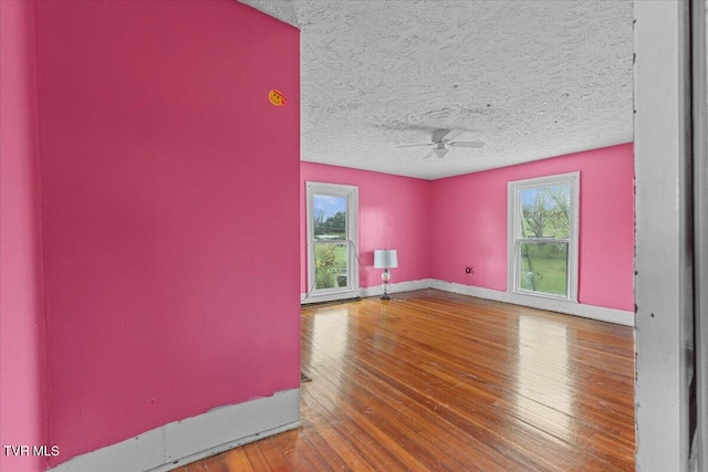 104 Maple St, Glade Spring, VA 24340 - unfurnished room featuring a ceiling fan, hardwood / wood-style flooring, baseboards, and a textured ceiling
