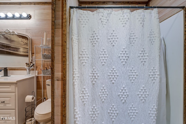 bathroom with a shower with shower curtain and toilet