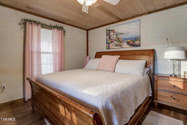 bedroom with dark hardwood / wood-style floors, ceiling fan, wooden walls, and wood ceiling