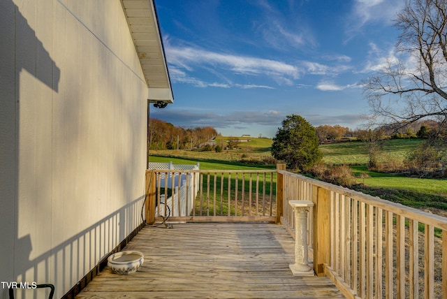 wooden deck featuring a rural view