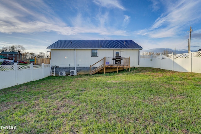 back of house featuring a wooden deck, a yard, and ac unit